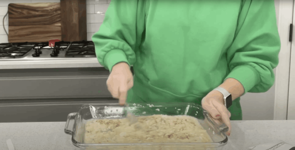 Lindsay mixing together the rice, water, and two condensed soups