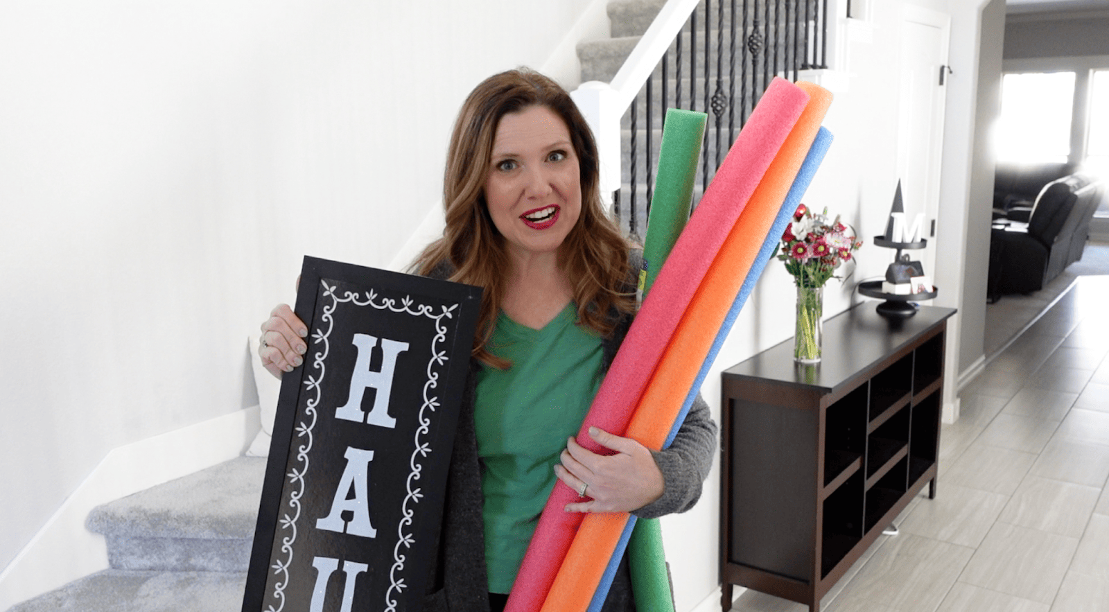Lindsay holding supplies needed to create the DIY project