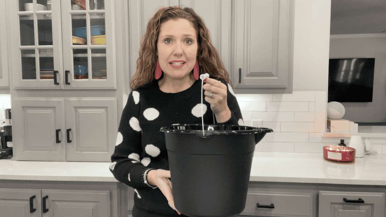 Lindsay holding black bucket