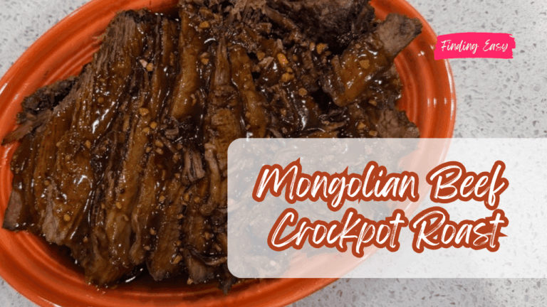 Slow cooker Mongolian beef chuck roast covered in savory brown sugar soy sauce gravy inside a crockpot.